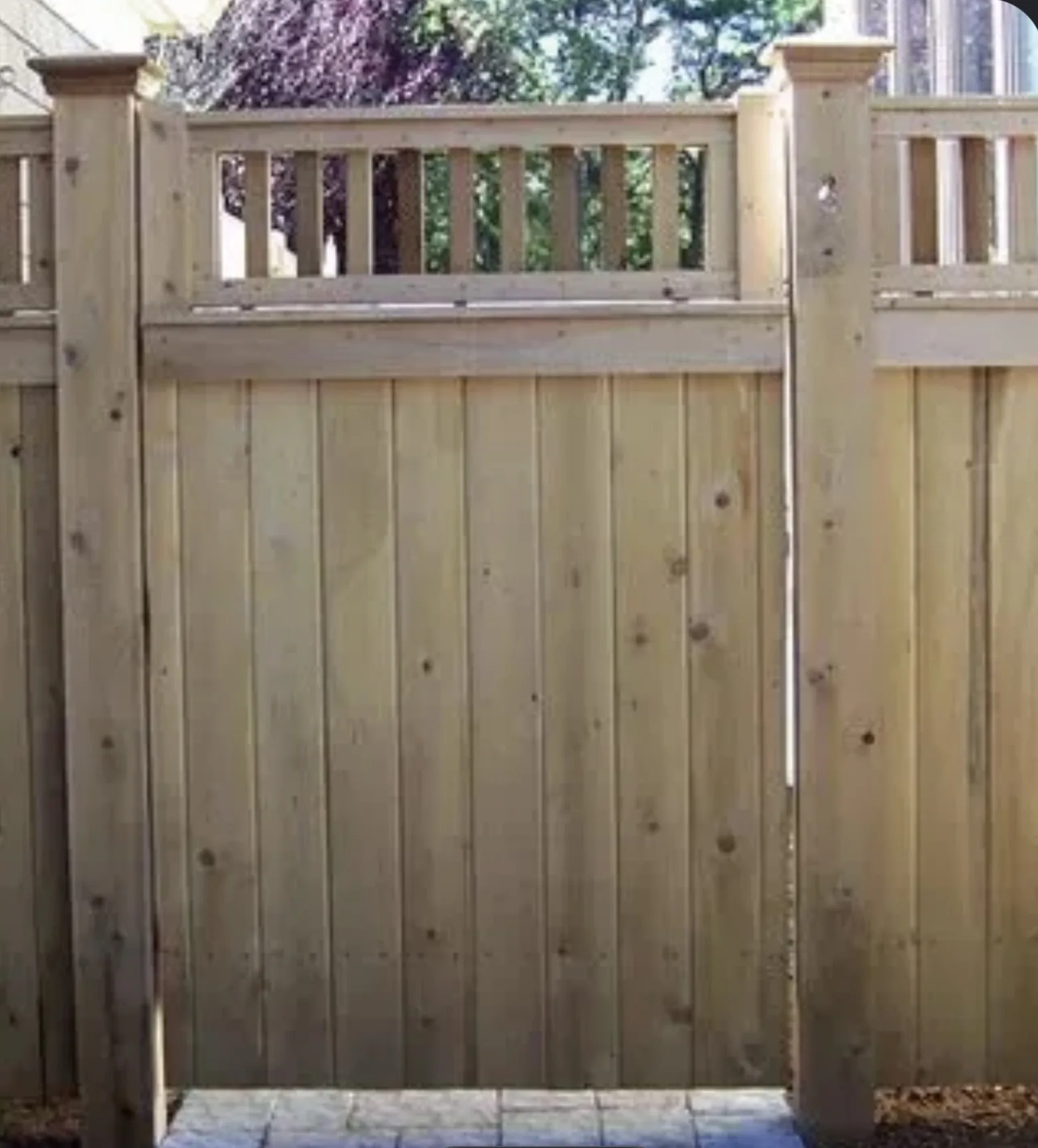 Cedar Privacy Gate with Spindle Top project by Excalibur Fence and Iron Works