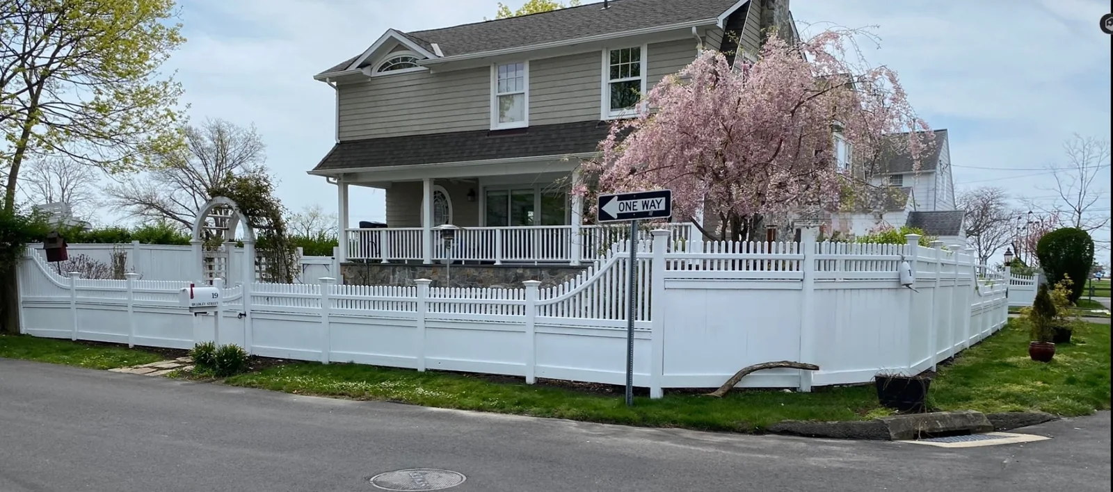 White Vinyl Picket & Privacy Fence with Arbor project by Excalibur Fence and Iron Works