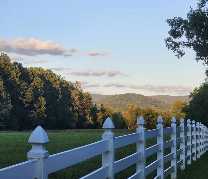 Vinyl Rail Fence with Gothic Post Caps project by Excalibur Fence and Iron Works