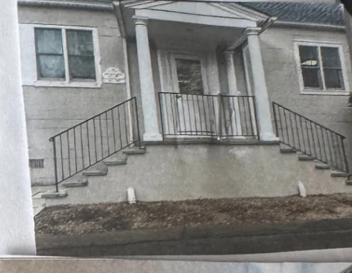 Black iron railings installed on residential front steps