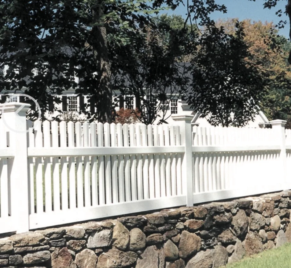 Scalloped Picket Fence on Stone Wall project by Excalibur Fence and Iron Works