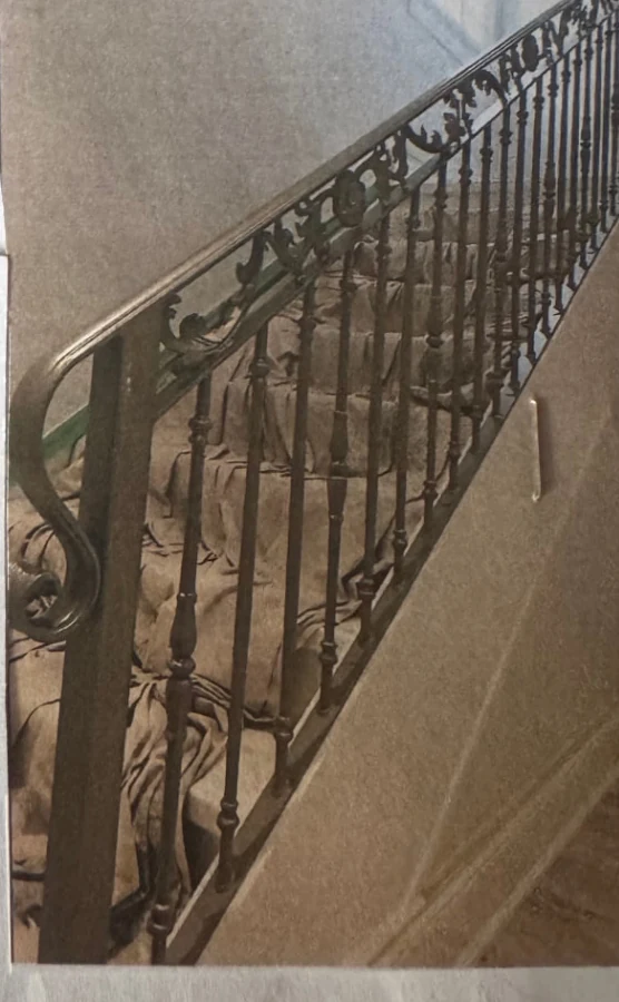 Detailed custom iron railing installed on an interior staircase