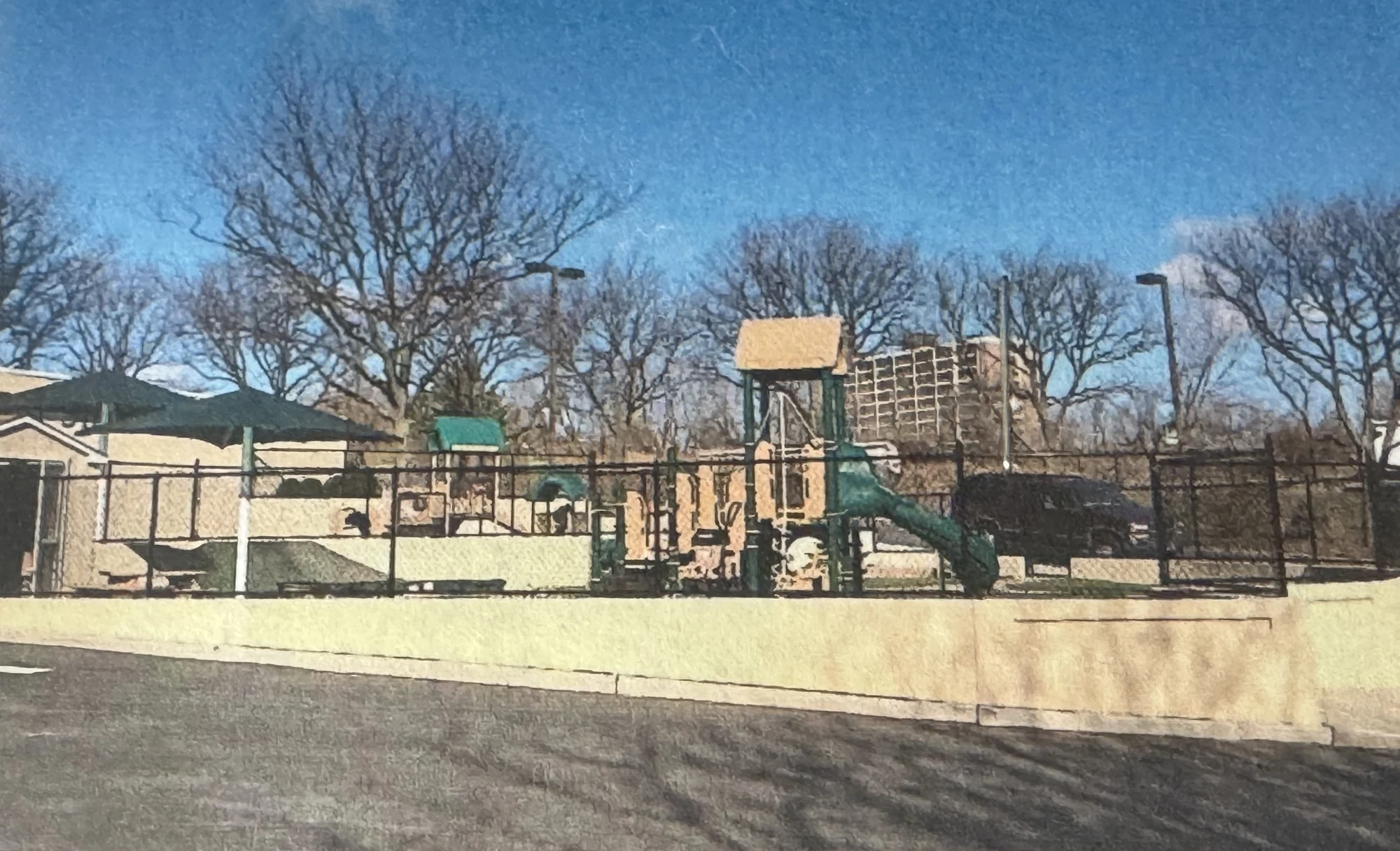 Tall chain link fencing around an athletic field