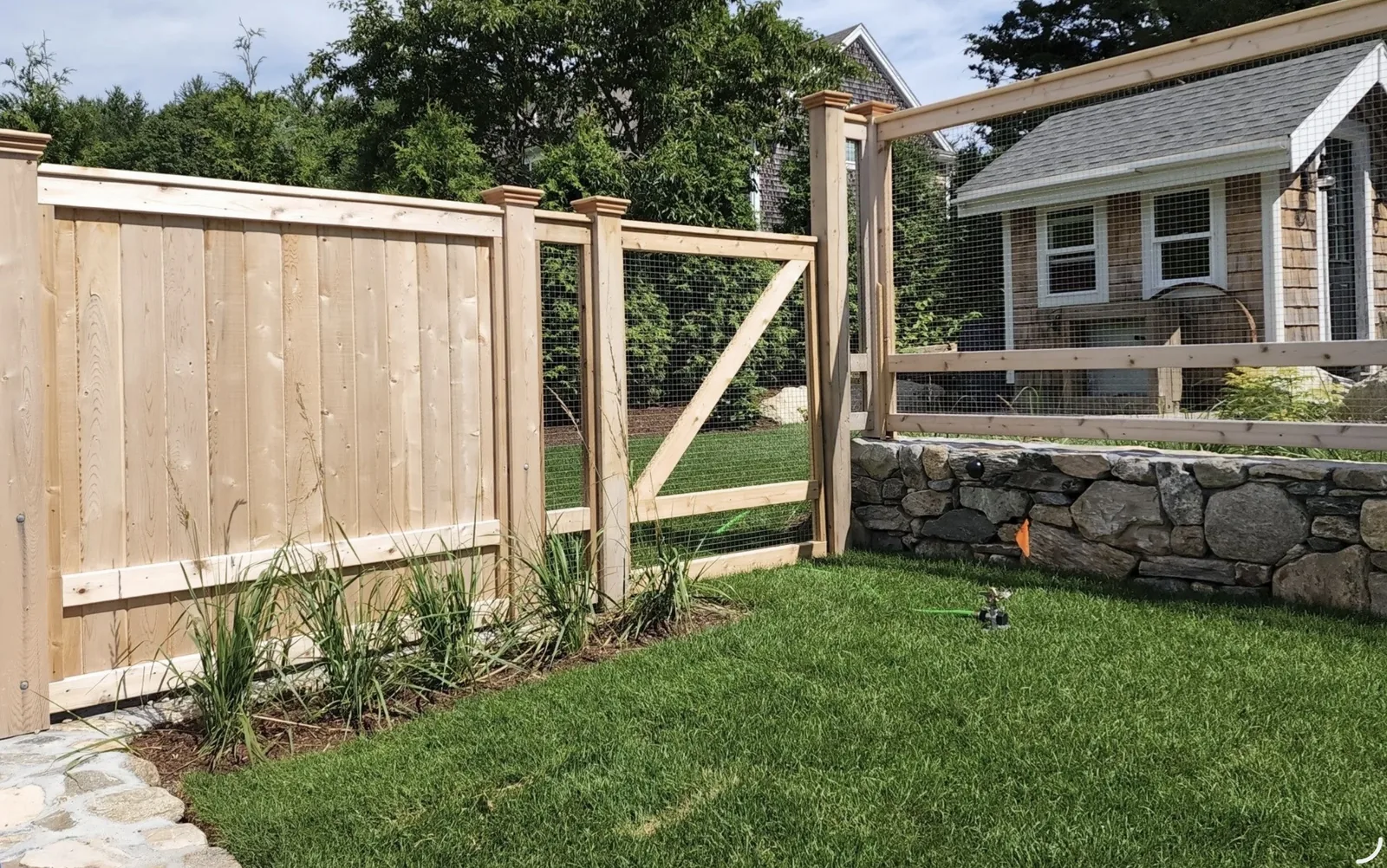 Cedar Privacy Fence with Arbor Gate project by Excalibur Fence and Iron Works
